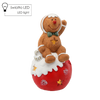 FIGURKA BOŻONAR. - PIERNIKOWY LUDZIK SIEDZĄCY NA BOMBCE 19 X 17 X 35 CM LED *0974