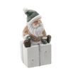 FIGURINE OF THE NATIVITY SCENE - SANTA SITTING ON A PRESENT 22,5 X 18 X 43,5 CM LED 
